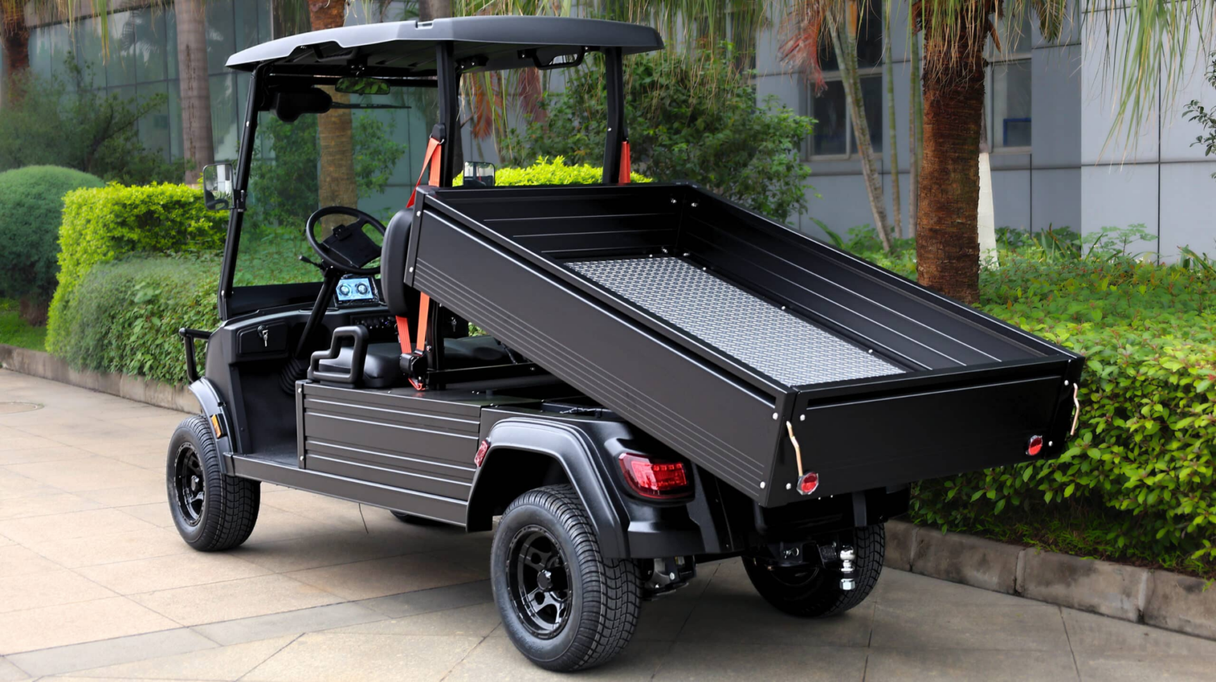 Fusion electric utility vehicle with raised tipping tray